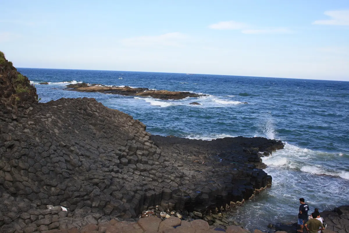 Waves breaking on the basalt shore at Ganh Da Dia