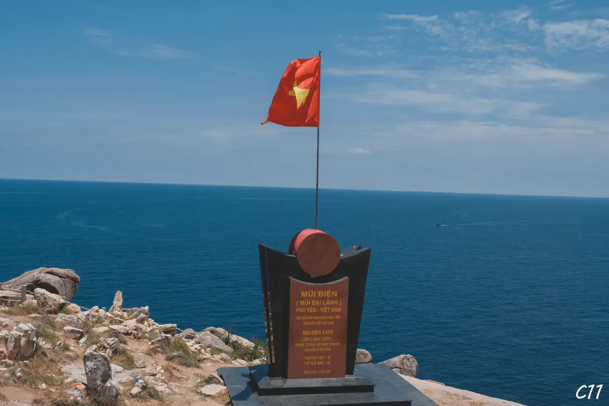The marker and flag at Mui Dien, the eastern cape